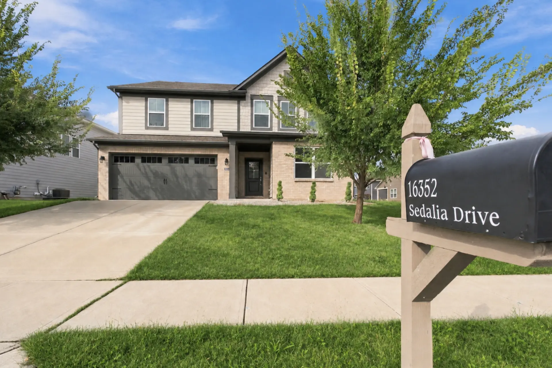 Front exterior and address mailbox at 16352 Sedalia Drive in Fishers, Indiana